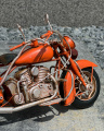Plechový model červeného motocyklu