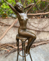 Bronzová soška figurka Nahá žena na židli